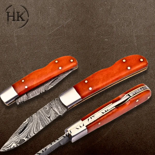 Handcrafted Damascus Steel Folding Knife with Vibrant Orange Handle - Image 3