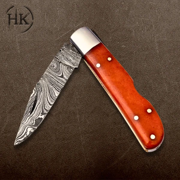 Handcrafted Damascus Steel Folding Knife with Vibrant Orange Handle - Image 4