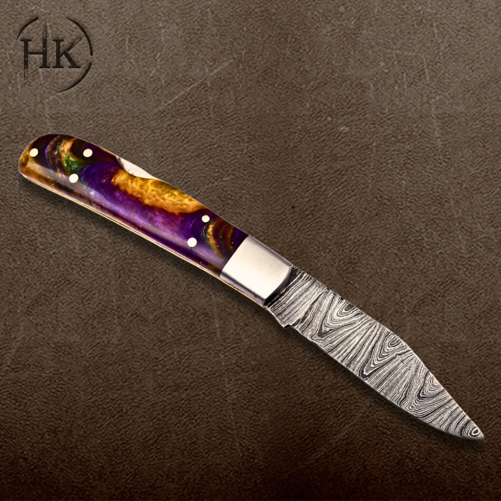 Handcrafted Damascus Steel Folding Knife with Vibrant Resin Handle - Image 4